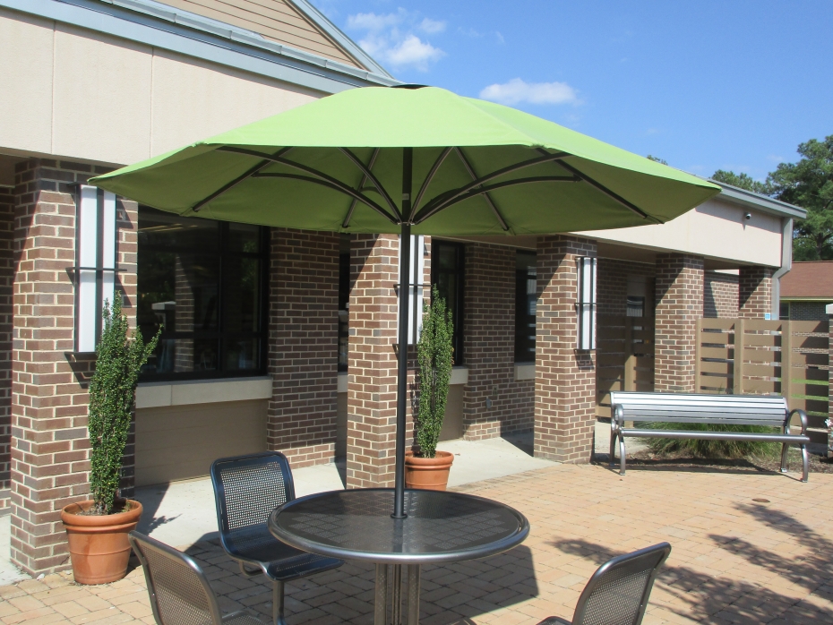 Table with Umbrella added to Patio at Eastover | Building Your Library